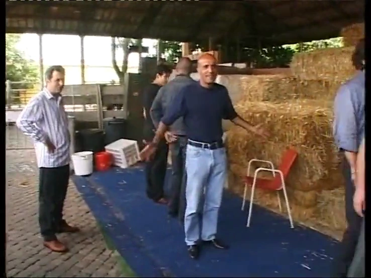 A group of horny men have sex with an innocent blonde in a barn porn video